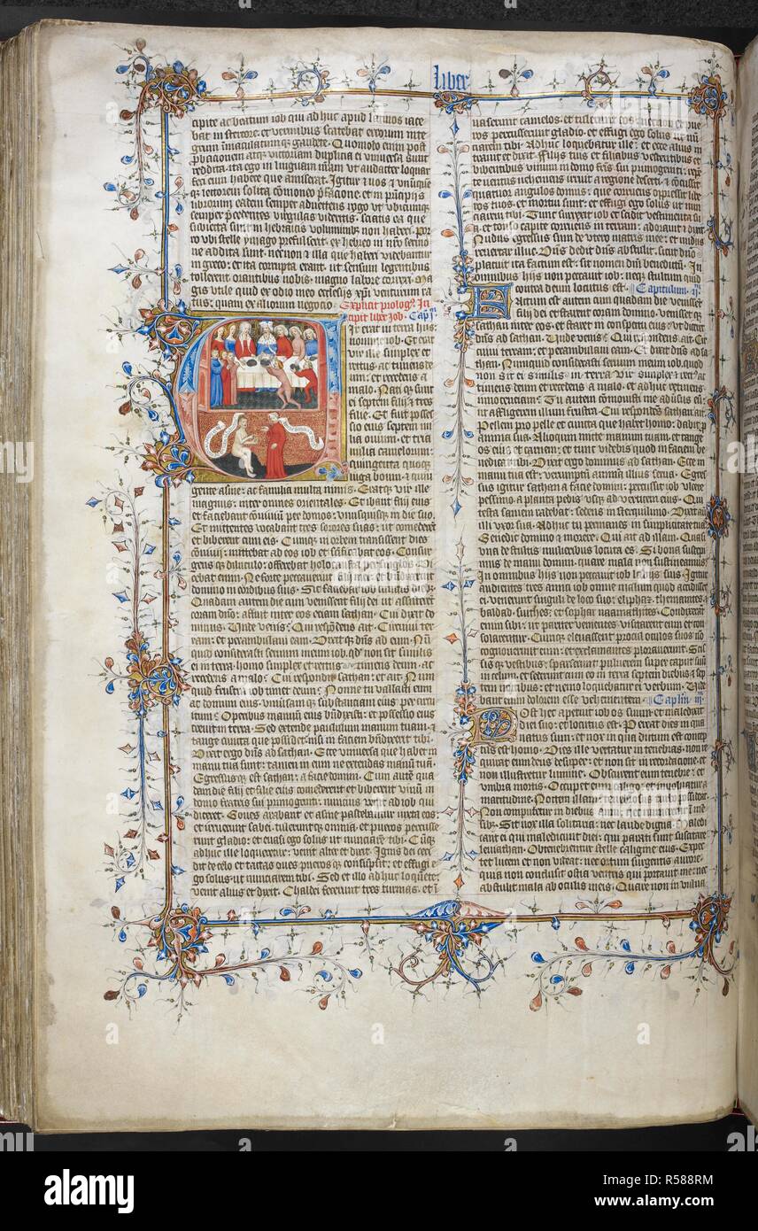 Historiated initial 'V'(ir) of Job feasting in the upper register, and Job and his wife in the lower register, with a full border, at the beginning of Job. Bible (the 'Big' or 'Great Bible'), with the Gospel of Nicodemus and the Interpretation of Hebrew names. England, S. E. (London?); 1st quarter of the 15th century. Source: Royal 1 E. IX, f.136v. Language: Latin. Stock Photo