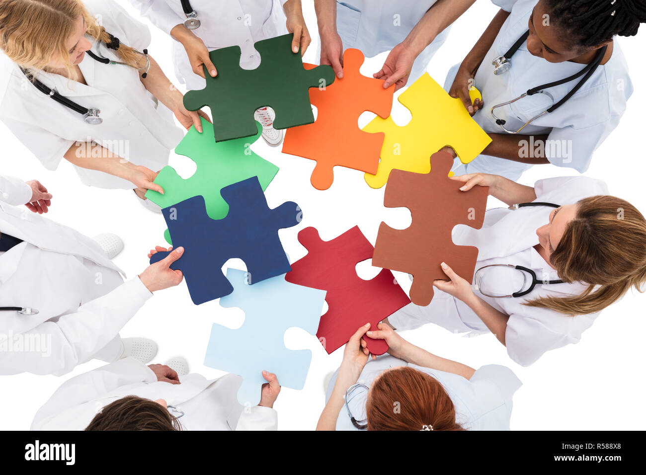 Medical Team Solving Jigsaw Puzzle Stock Photo Alamy
