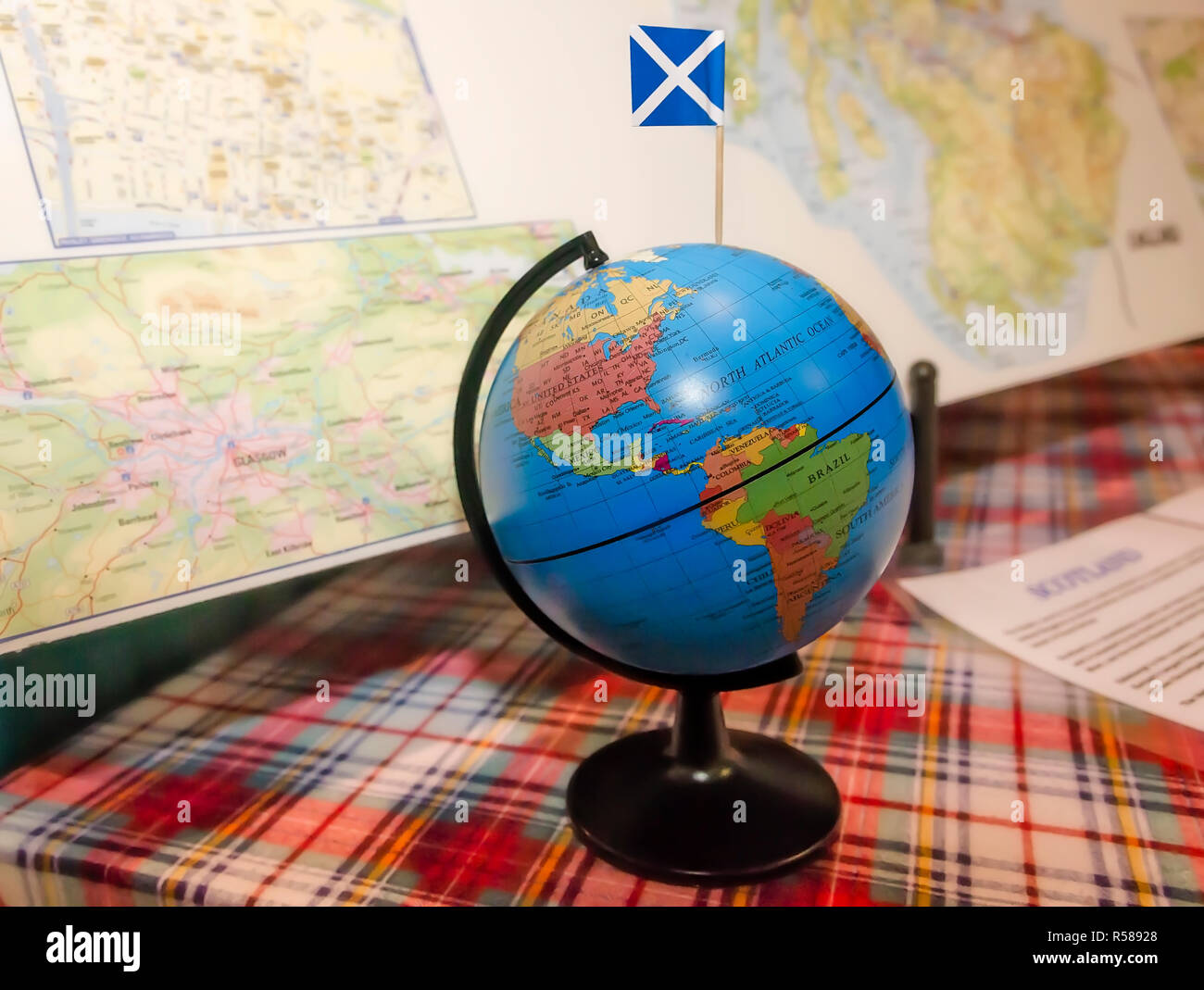 The Scotland flag is inserted in a globe and displayed with maps at the 34th annual Mobile International Festival, Nov. 17, 2018, in Mobile, Alabama. Stock Photo