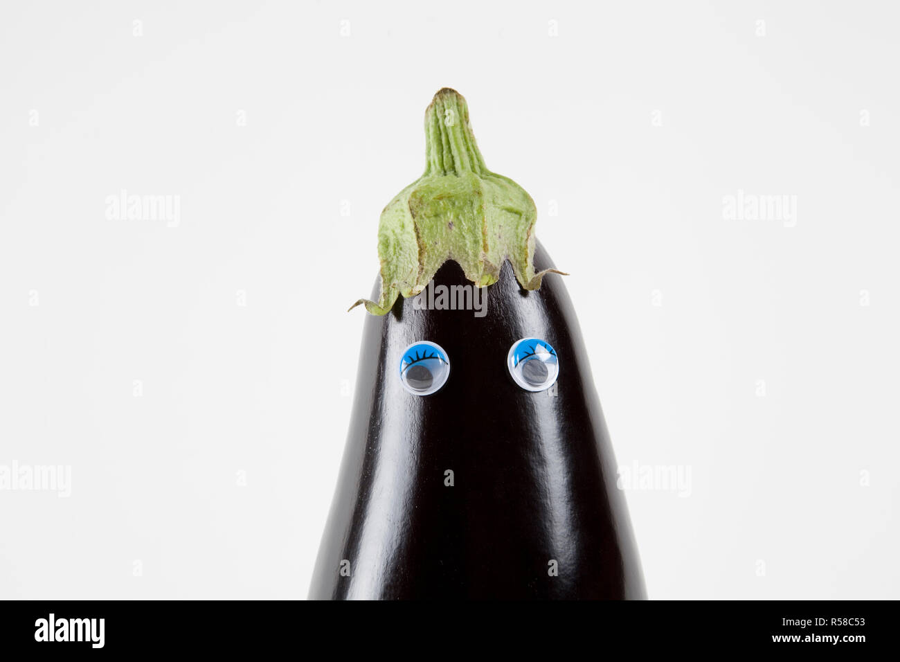 eggplant doll eyes back white Stock Photo Alamy