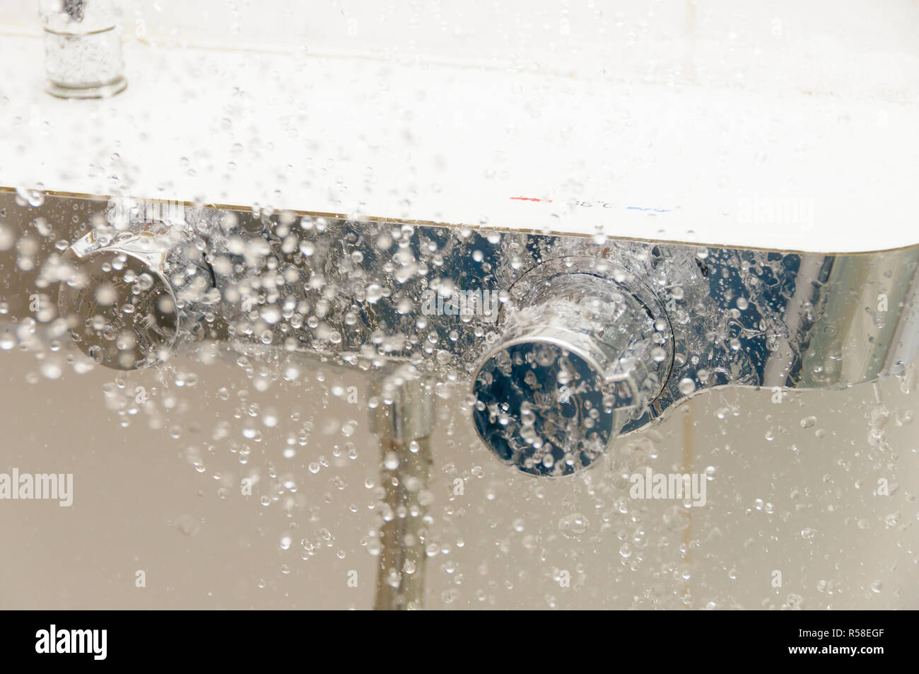 Running Water splashing out of a shower. Stock Photo