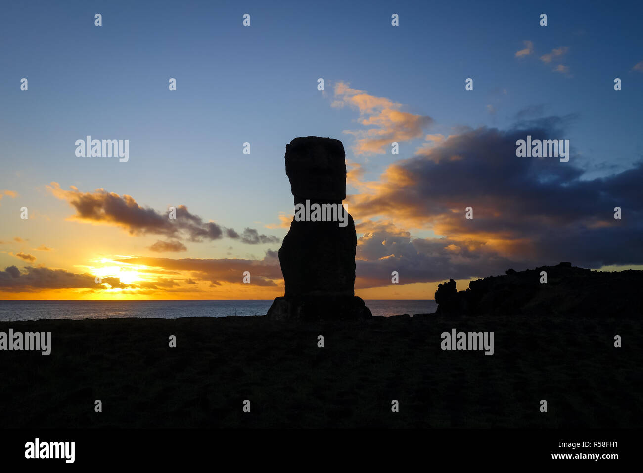 Moai statue ahu akapu at sunset, easter island Stock Photo