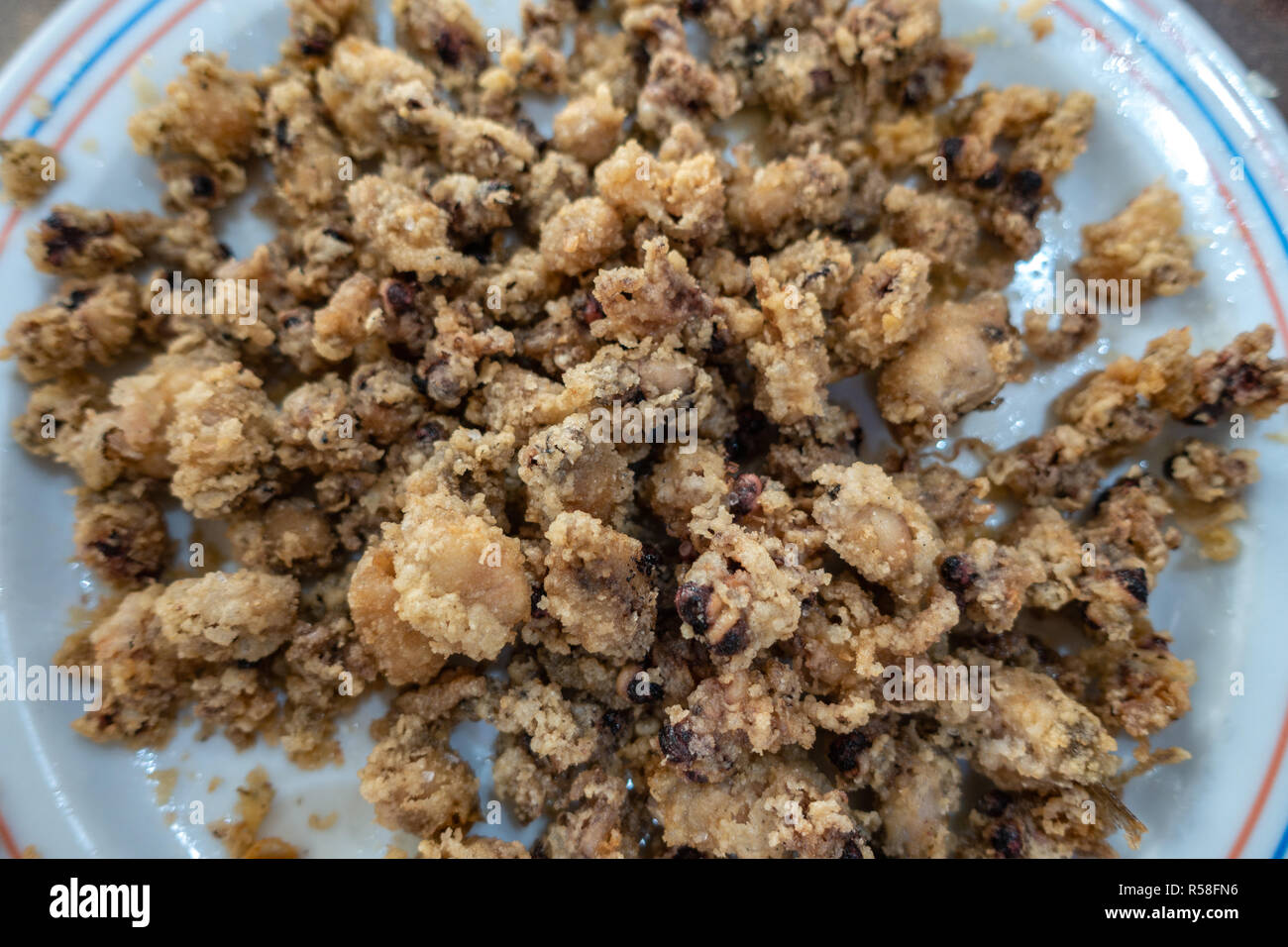 A plate of freshly cooked deep fried battered chopitos baby squids