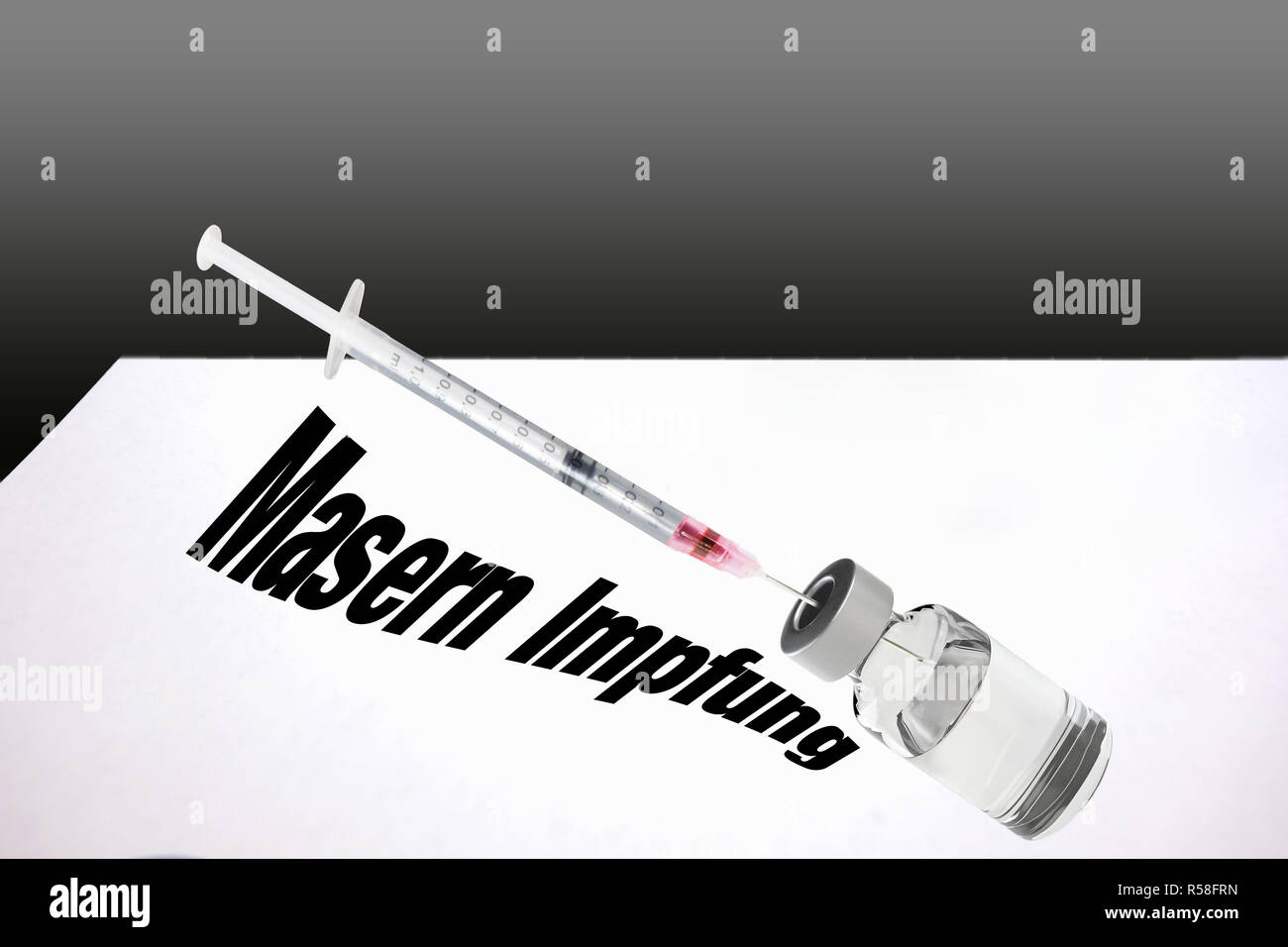 syringe is filled with vaccine for measles vaccine. Stock Photo