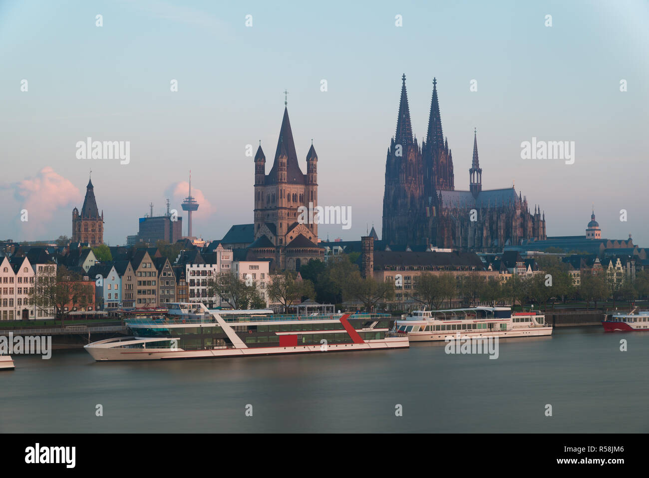 Image of Cologne with Cologne Cathedral with Rhine river during twilight blue hour in Germany. Stock Photo