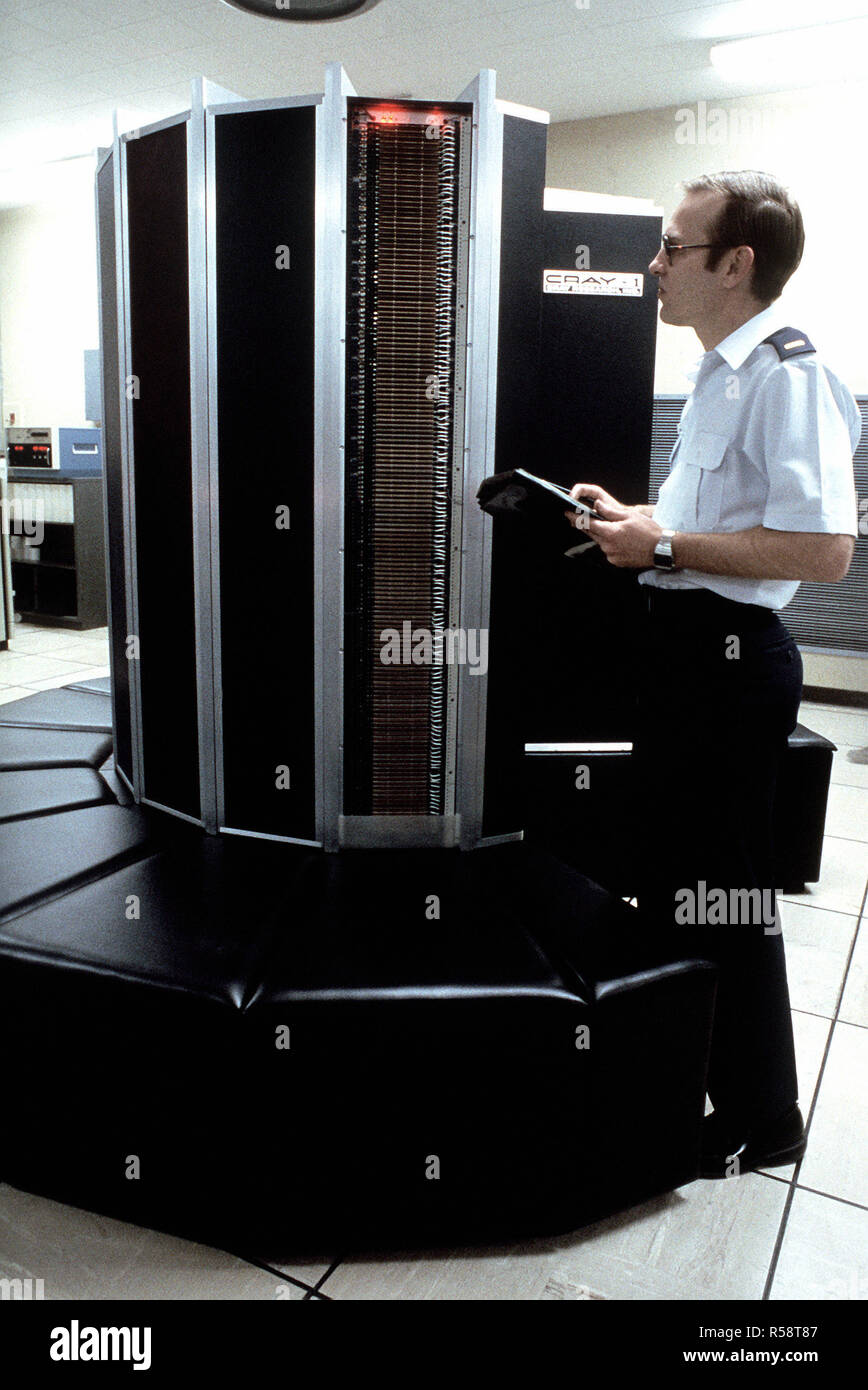 A technician works on a Cray-1 computer. Stock Photo
