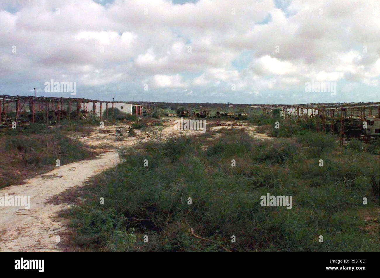 Panoramic view of the dilapidated vehicles and buildings from the abandoned Soviet Surface to Air Missile site north of Sword Base, outside of Mogadishu, Somalia.  The base is being prepared for destruction and this mission is in direct support of Operation Restore Hope. Stock Photo