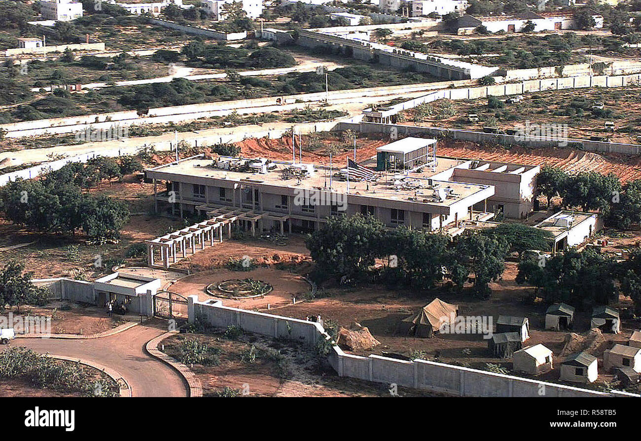 1992 - Aerial view of the front of the US Embassy Compound in Mogadishu, Somalia.  The Joint Task Force Headquarters for Restore Hope is located there.  There are plans to build a tent city on the compound.  Some tents are erected on the lower right hand corner of the frame.  This mission is in direct support of Operation Restore Hope. Stock Photo