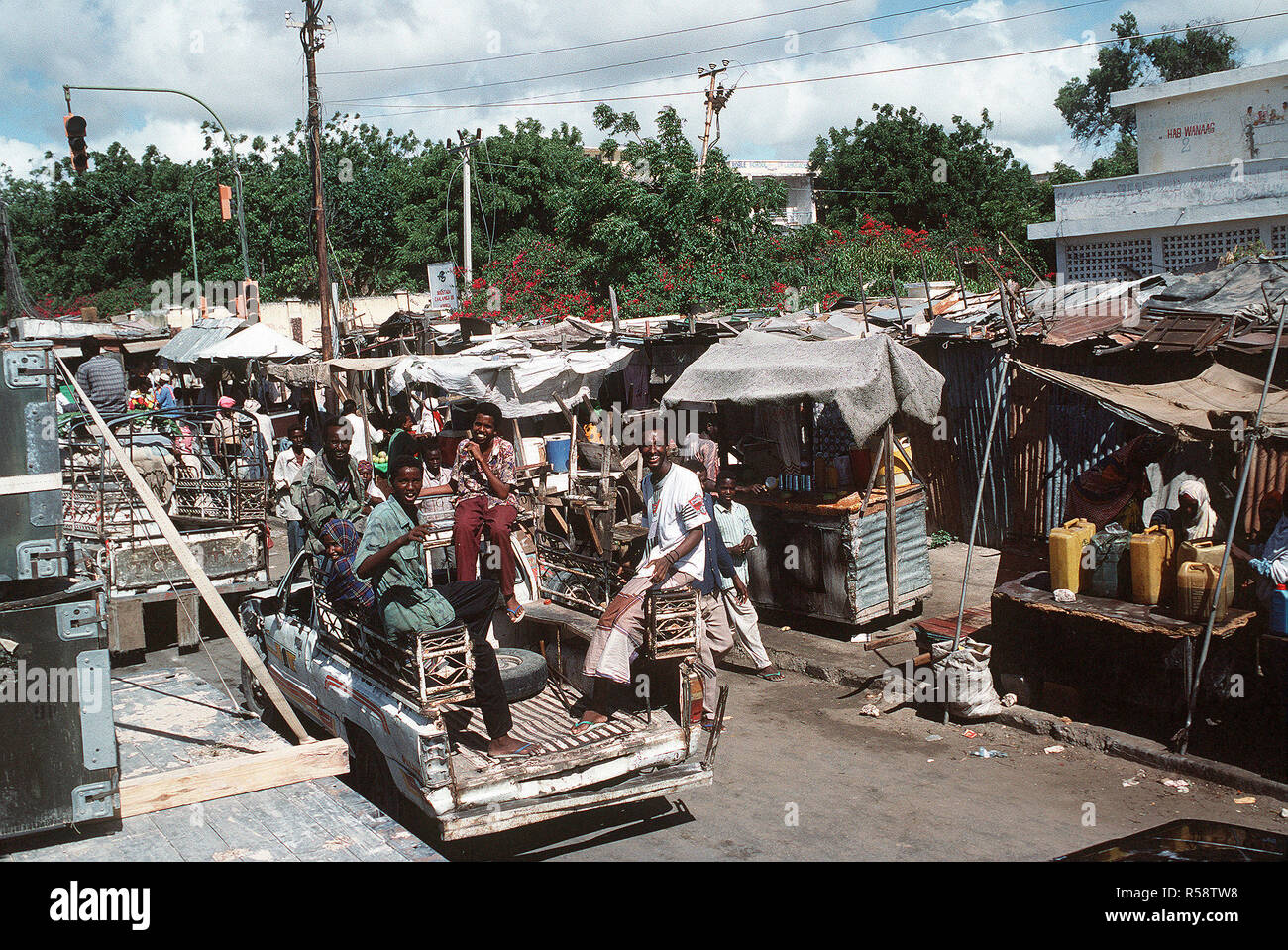 1992 - A group of Somali men, riding in a truck, smile for the camera during the multinational relief effort Operation Restore Hope. (Mogadishu Somalia) Stock Photo