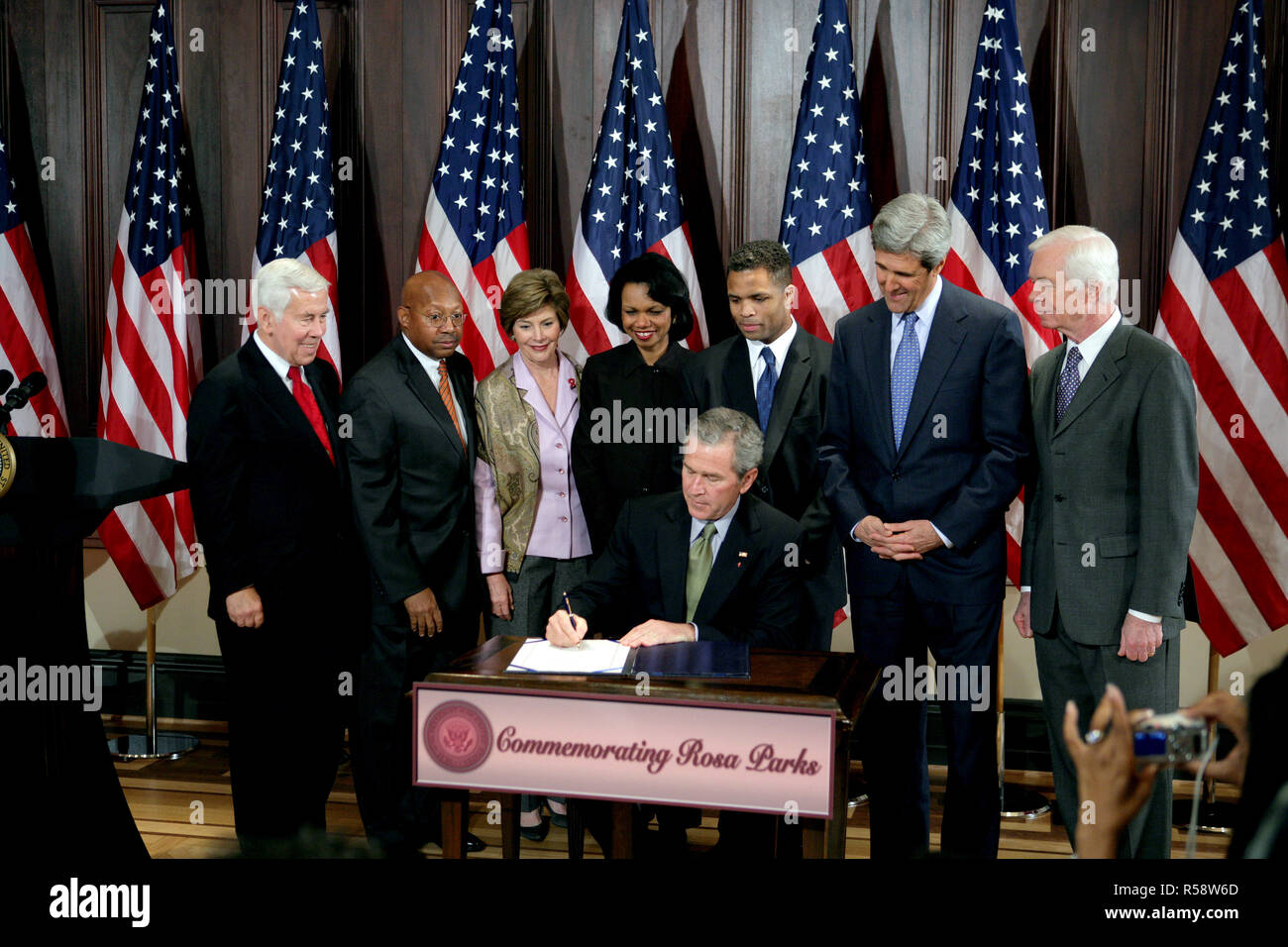 President George W. Bush is seen Thursday, Dec. 1. 2005 in the Eisenhower Executuive Office Building in Washington, as he signs H.R. 4145, to Direct the Joint Committee on the Library to Obtain a Statue of Rosa Parks, which will be placed in the US Capitol's National Statuary Hall. The President is joined by, from left to right, U.S. Sen. Richard G. Lugar, R-Ind., U.S. Secretary of Housing and Urban Development Alphonso Jackson, Mrs. Laura Bush, U.S. Secretary of State Condoleezza Rice, U.S. Rep. Jesse Jackson Jr., D-Ill., U.S. Sen. John Kerry, D-Mass., and U.S. Sen. Thad Cochran, R-Miss. Stock Photo