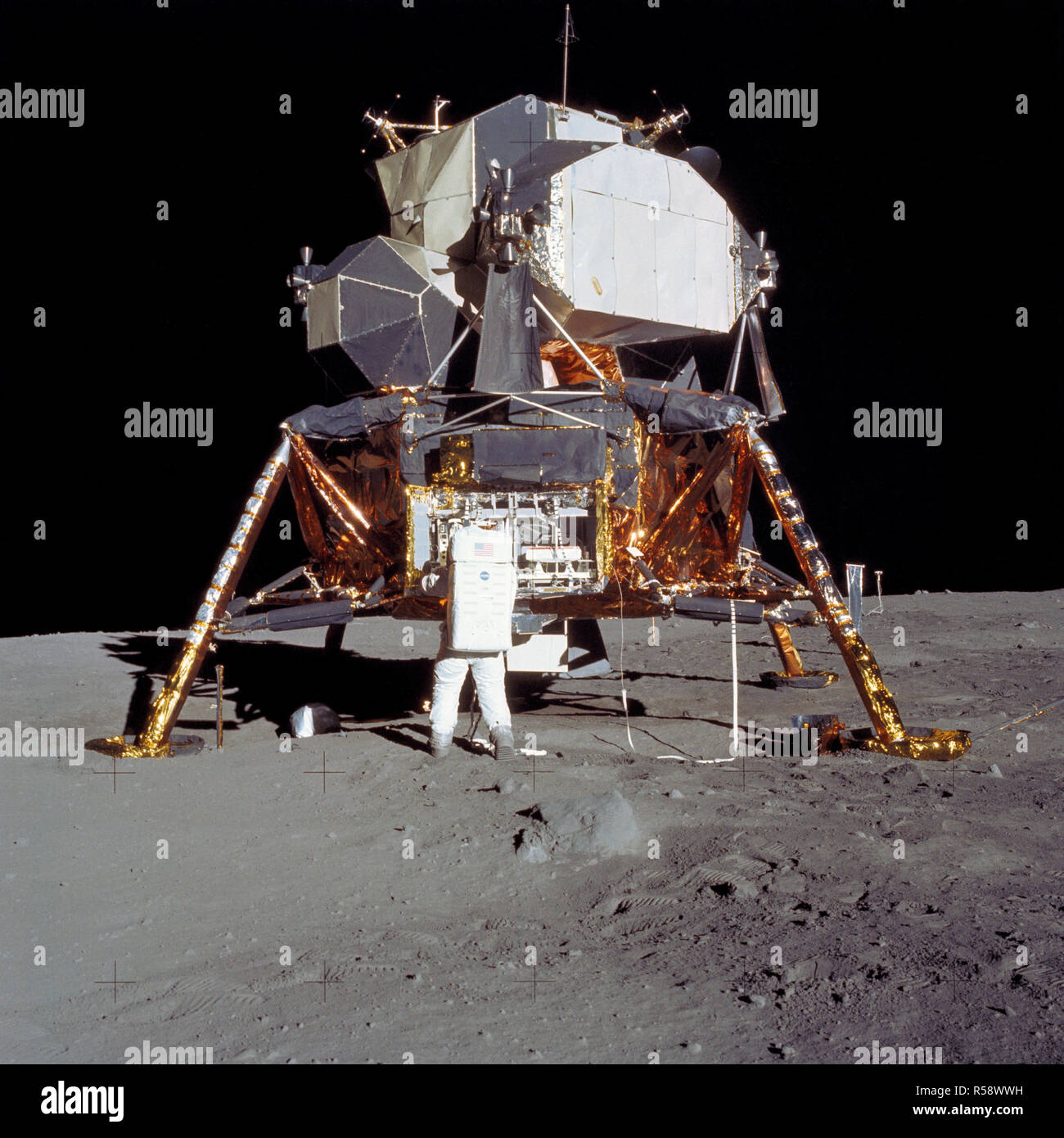 (20 July 1969) --- Astronaut Edwin E. Aldrin Jr., lunar module pilot, prepares to deploy the Early Apollo Scientific Experiments Package (EASEP) during the Apollo 11 lunar surface extravehicular activity (EVA). Stock Photo