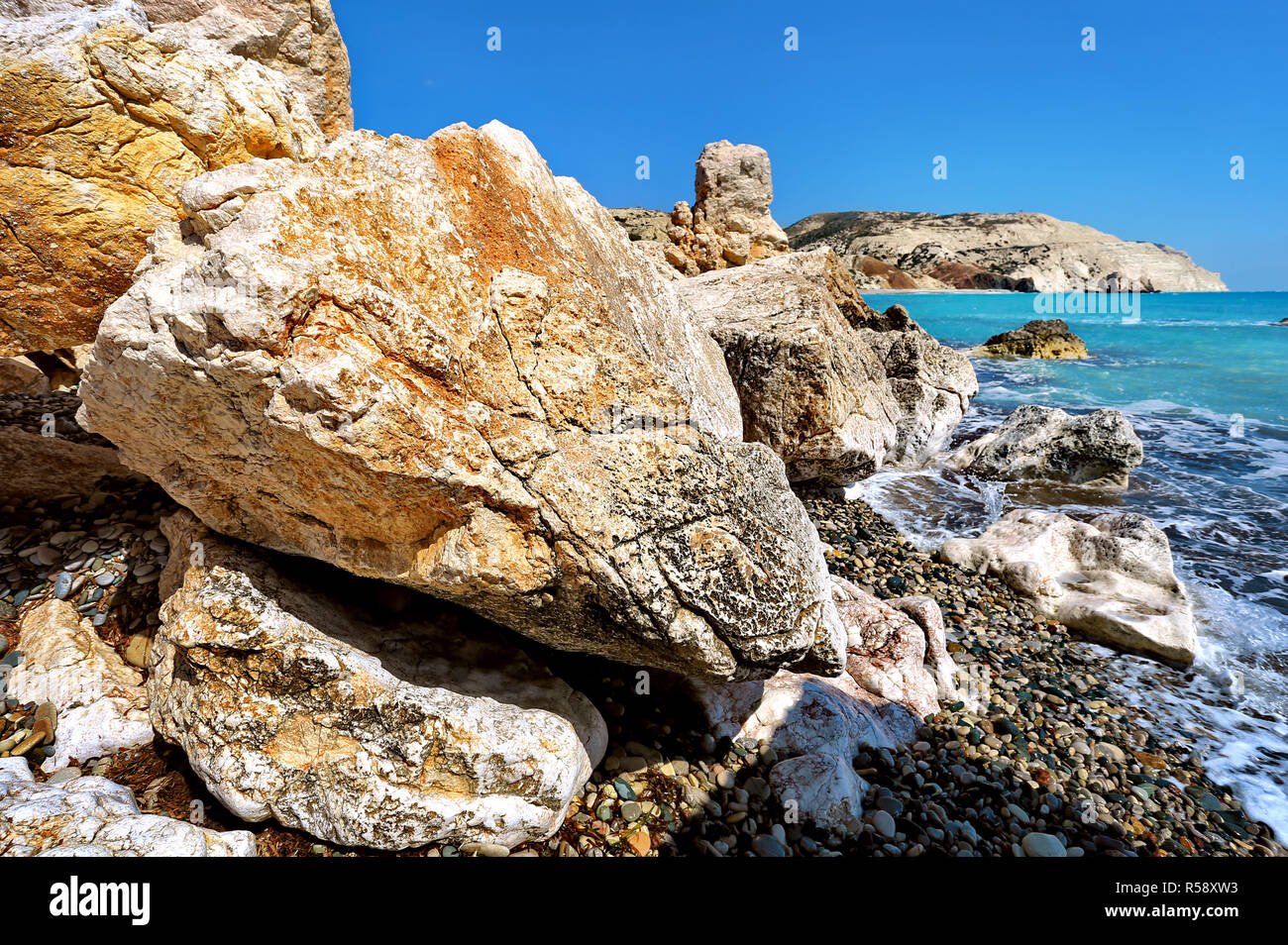 Rock of Aphrodite (Petra Tou Romiou) the birthplace of Aphrodite the Greek goddess of love, on a shoreline beach of  Western Cyprus near Paphos. Stock Photo