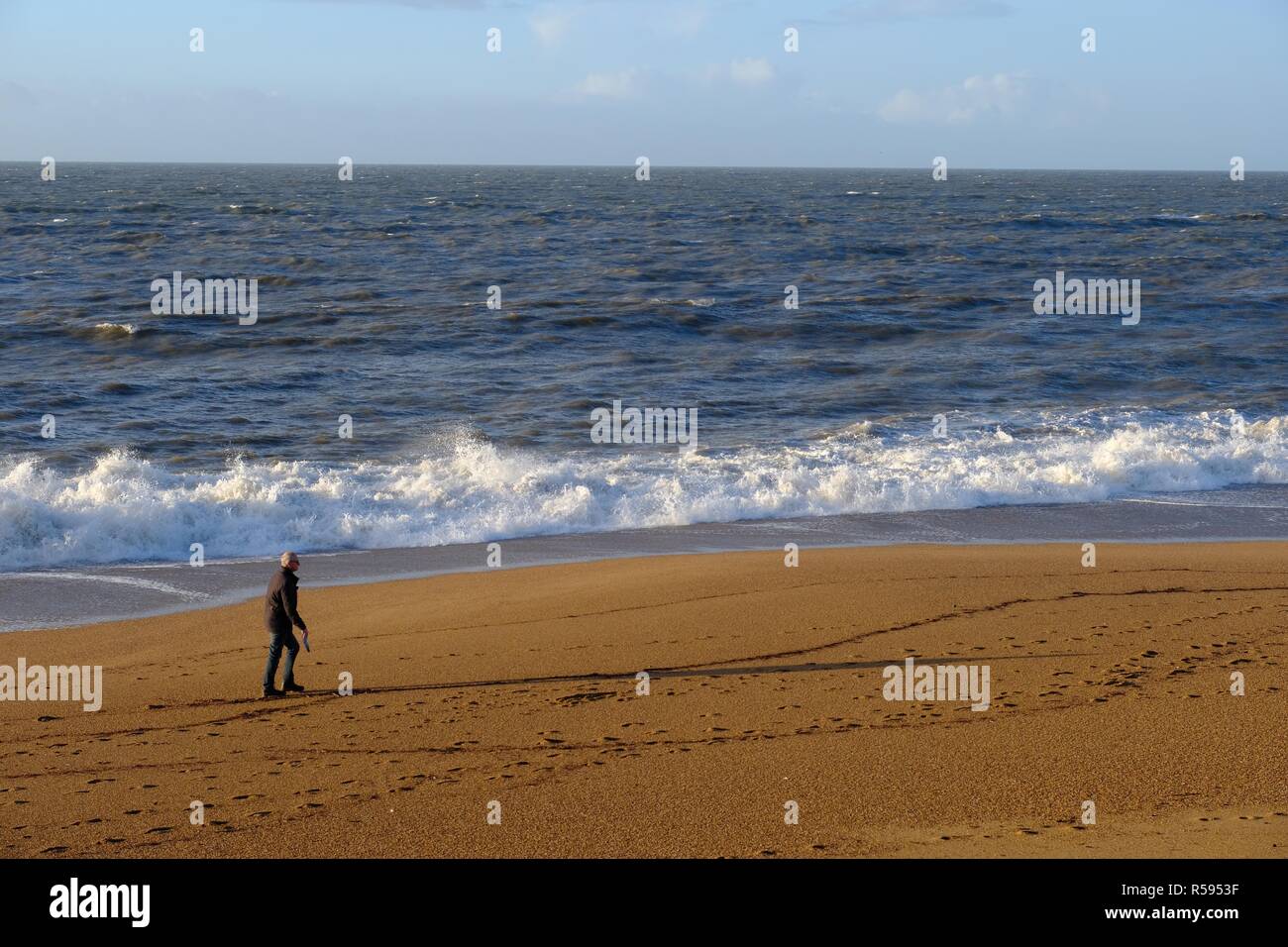 West Bay, Dorset, UK. 30 November 2018. After two days of storms fishermen enjoy the good weather as sunshine returns to West Bay on the Dorset coast Credit: Tom Corban/Alamy Live News Stock Photo