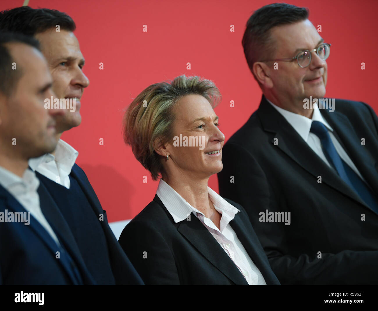 30 November 2018, Hessen, Frankfurt/Main: Joti Chatzialexiou (l-r), Sports Director of the national teams, Oliver Bierhoff, DFB Director National Teams, and Reinhard Grindel, President of the German Football Association (DFB), will take part in the press conference to present Martina Voss-Tecklenburg, the new national coach of the women's national team, at the DFB headquarters. Voss-Tecklenburg was previously coach of the Swiss women's national team and is the successor to Horst Hrubesch. Photo: Arne Dedert/dpa Stock Photo