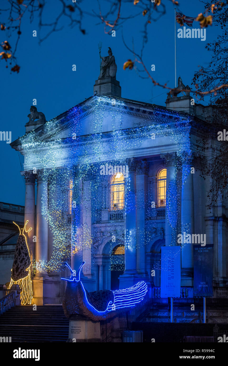 London, UK. 30th Nov 2018. Tate Britain Winter Commission, devised by the Turner Prize nominated artist Monster Chetwynd. The artist, formerly known as 'Marvin Gaye' and 'Spartacus', has transformed Tate Britain's Neo-Classical façade inspired by the winter solstice, with a light display and elements of sculpture to mark the winter season. It will be switched on daily between 05:00-00:00, from 1st December 2018 - 28 February 2019. Credit: Guy Bell/Alamy Live News Stock Photo