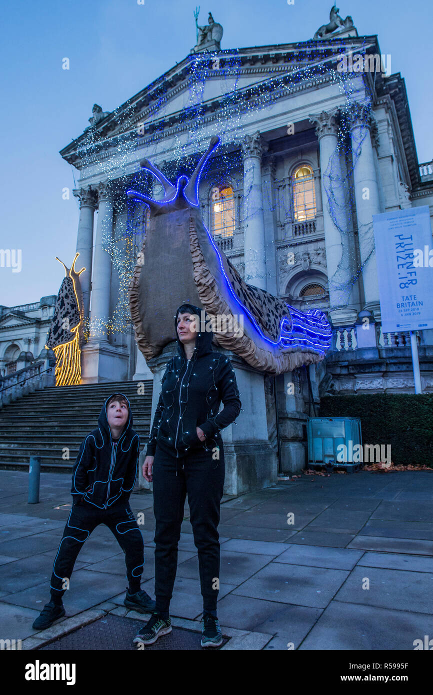 London, UK. 30th Nov 2018. Tate Britain Winter Commission, devised by the Turner Prize nominated artist Monster Chetwynd (pictured with her son). The artist, formerly known as 'Marvin Gaye' and 'Spartacus', has transformed Tate Britain's Neo-Classical façade inspired by the winter solstice, with a light display and elements of sculpture to mark the winter season. It will be switched on daily between 05:00-00:00, from 1st December 2018 - 28 February 2019. Credit: Guy Bell/Alamy Live News Stock Photo