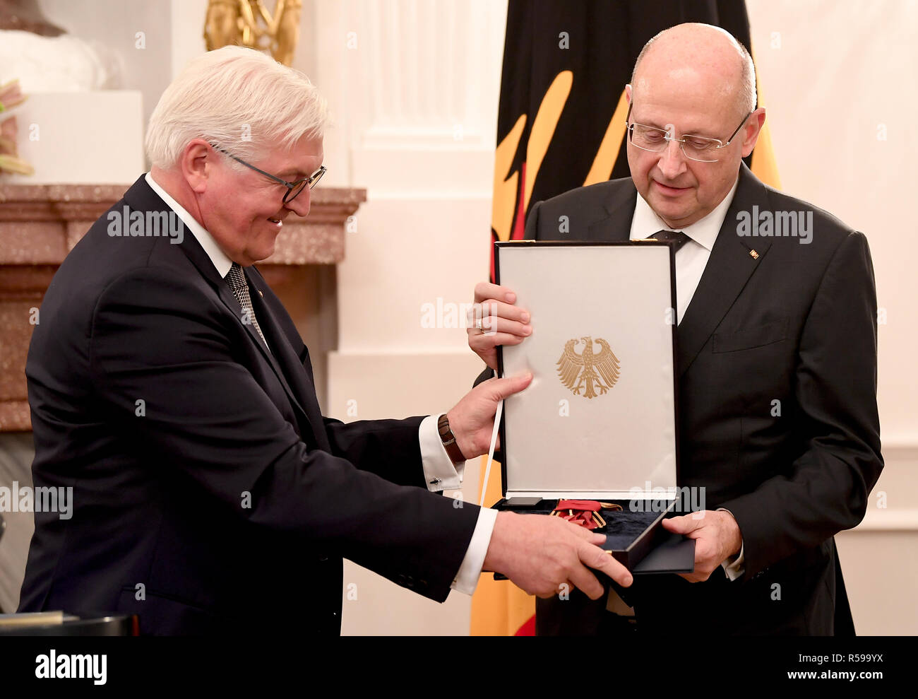Berlin, Germany. 30th Nov, 2018. Federal President Frank-Walter Steinmeier (l) dismisses Ferdinand Kirchhof from his position as Vice-President of the Federal Constitutional Court and awards him the Grand Cross of Merit. Credit: Britta Pedersen/dpa/Alamy Live News Stock Photo