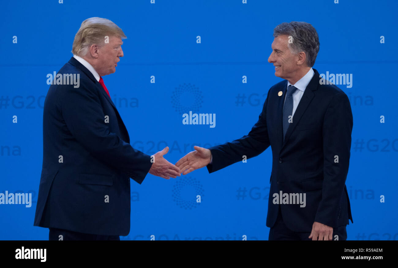 Buenos Aires, Argentina. 30th Nov, 2018. Donald Trump (l), President of the United States, is welcomed by Mauricio Macri, President of Argentina, at the G20 Summit Meeting Centre in Buenos Aires. From 30.11.-1.12.2018 the G20 summit will take place in Buenos Aires. The 'Group of 20' unites the strongest industrial nations and emerging economies. Credit: Ralf Hirschberger/dpa/Alamy Live News Stock Photo