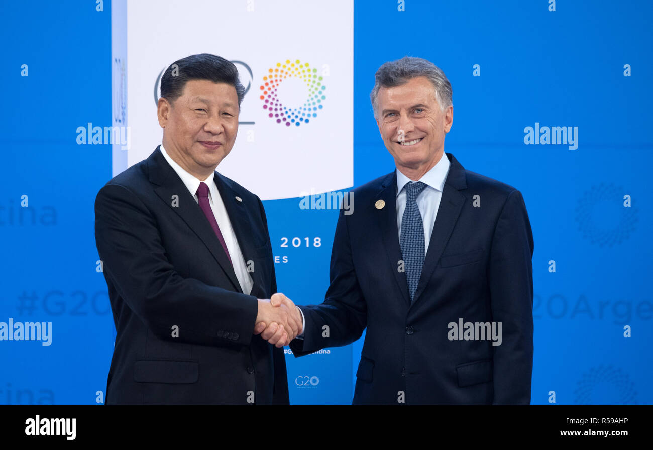 Buenos Aires, Argentina. 30th Nov, 2018. Xi Jinping (l), President of China, is welcomed by Mauricio Macri, President of Argentina at the G20 Summit Centre in Buenos Aires.30.11.-1.12.2018 the G20 Summit will take place in Buenos Aires. The 'Group of 20' unites the strongest industrial nations and emerging economies. Credit: Ralf Hirschberger/dpa/Alamy Live News Stock Photo