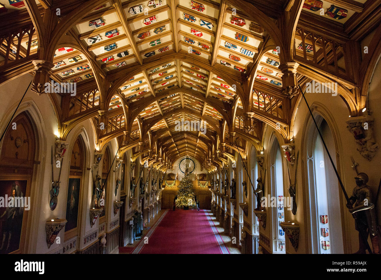 Windsor, UK. 30th Nov, 2018. The State Apartments at Windsor Castle have been decorated with glittering Christmas trees and twinkling lights for Christmas. Seen here in St George's Hall a striking 20ft Nordmann Fir tree from Windsor Great Park dressed in gold. A 15ft Christmas tree also appears in the Crimson Drawing Room. Credit: Mark Kerrison/Alamy Live News Stock Photo