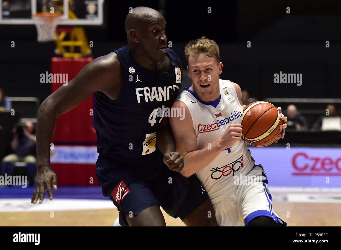 Ousmane Camara of France, left, and Tomas Vyoral of Czech Republic fight  for a ball during the qualification match for the Basketball World Cup 2019 Czech  Republic vs France in Pardubice, Czech