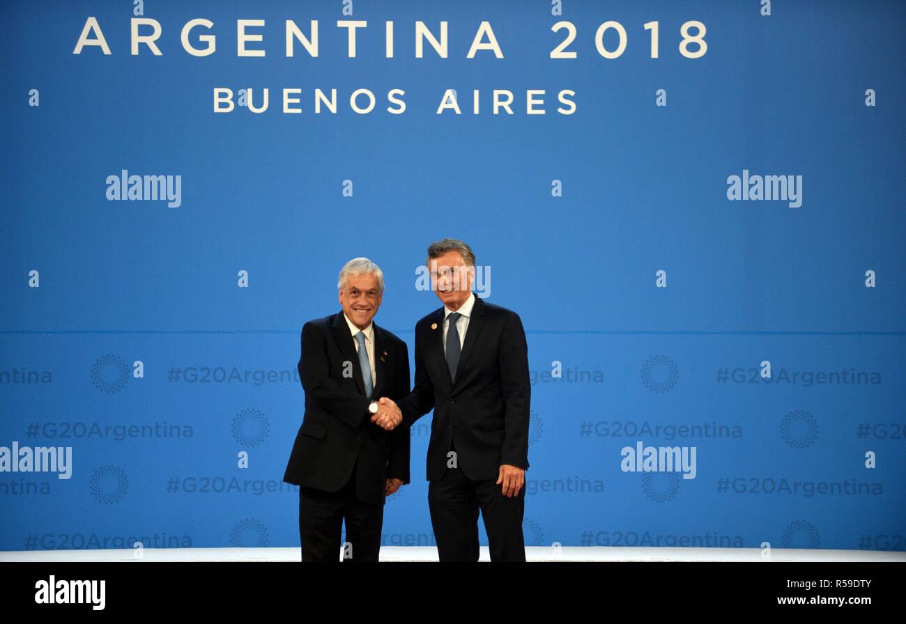 Buenos Aires, Argentina. 30th Nov, 2018. Argentine President Mauricio Macri, right, welcomes Chilean President Sebastian Pinera at the start of the G20 Summit meeting at the Costa Salguero Center November 30, 2018 in Buenos Aires, Argentina. Credit: Planetpix/Alamy Live News Stock Photo