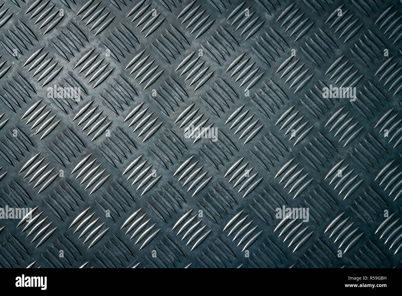 Industrial metal checker plate. Metal checker plate texture background. Metal checkerplate for anti skid. Embossed metal sheet floor. Silver bump grou Stock Photo