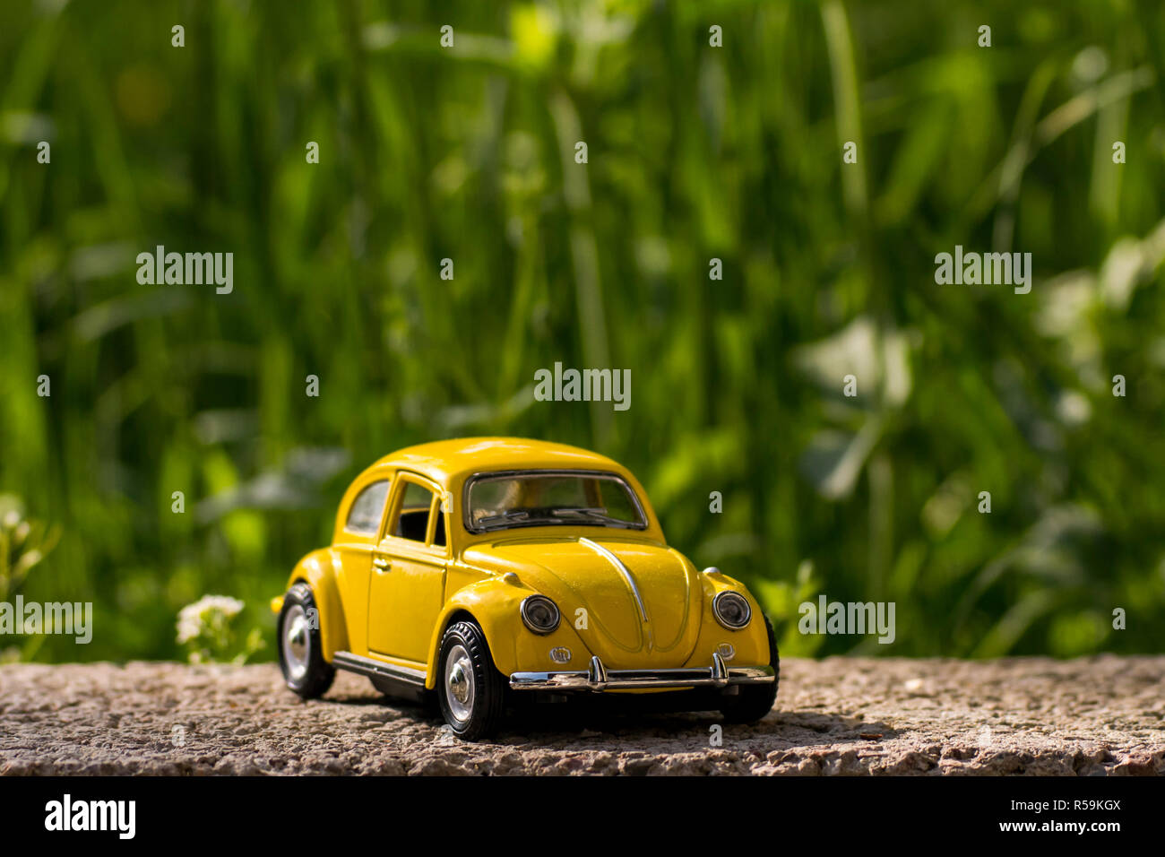 Yellow Volkswagen Beetle model car toy Stock Photo