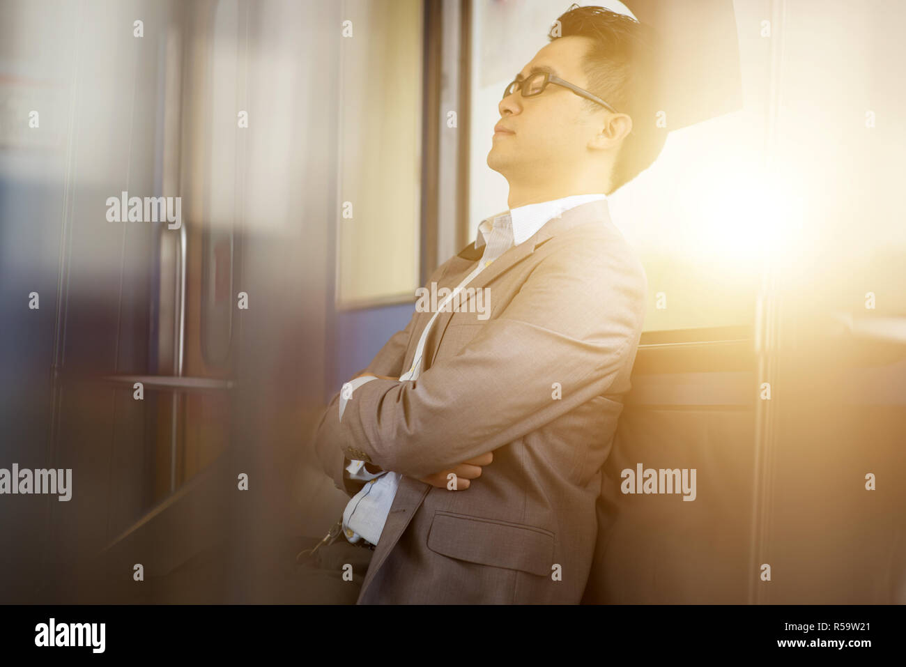 Napping inside train Stock Photo