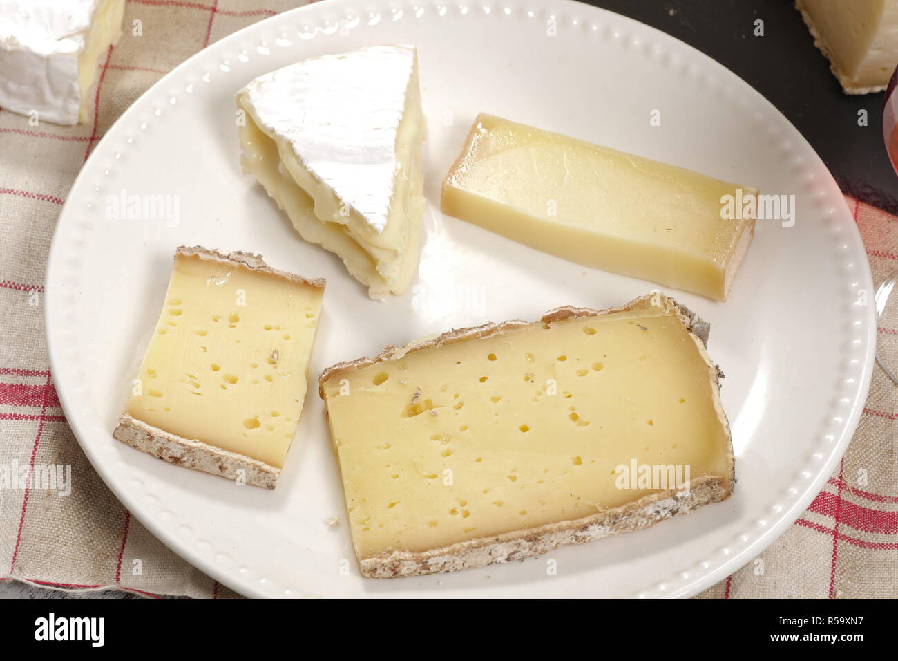 Different french cheeses on plate Stock Photo Alamy