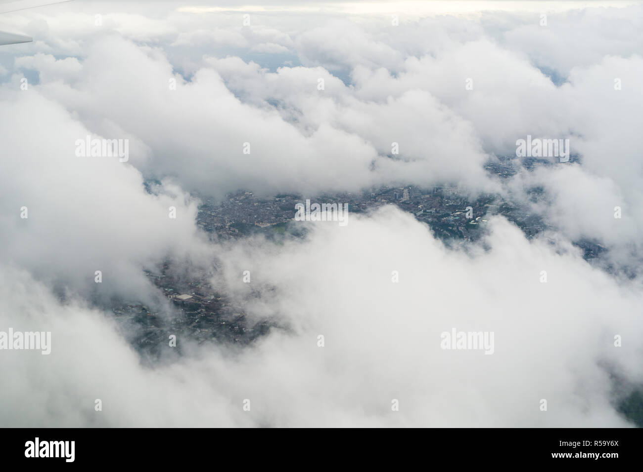 Flying over London on a cloudy day Stock Photo