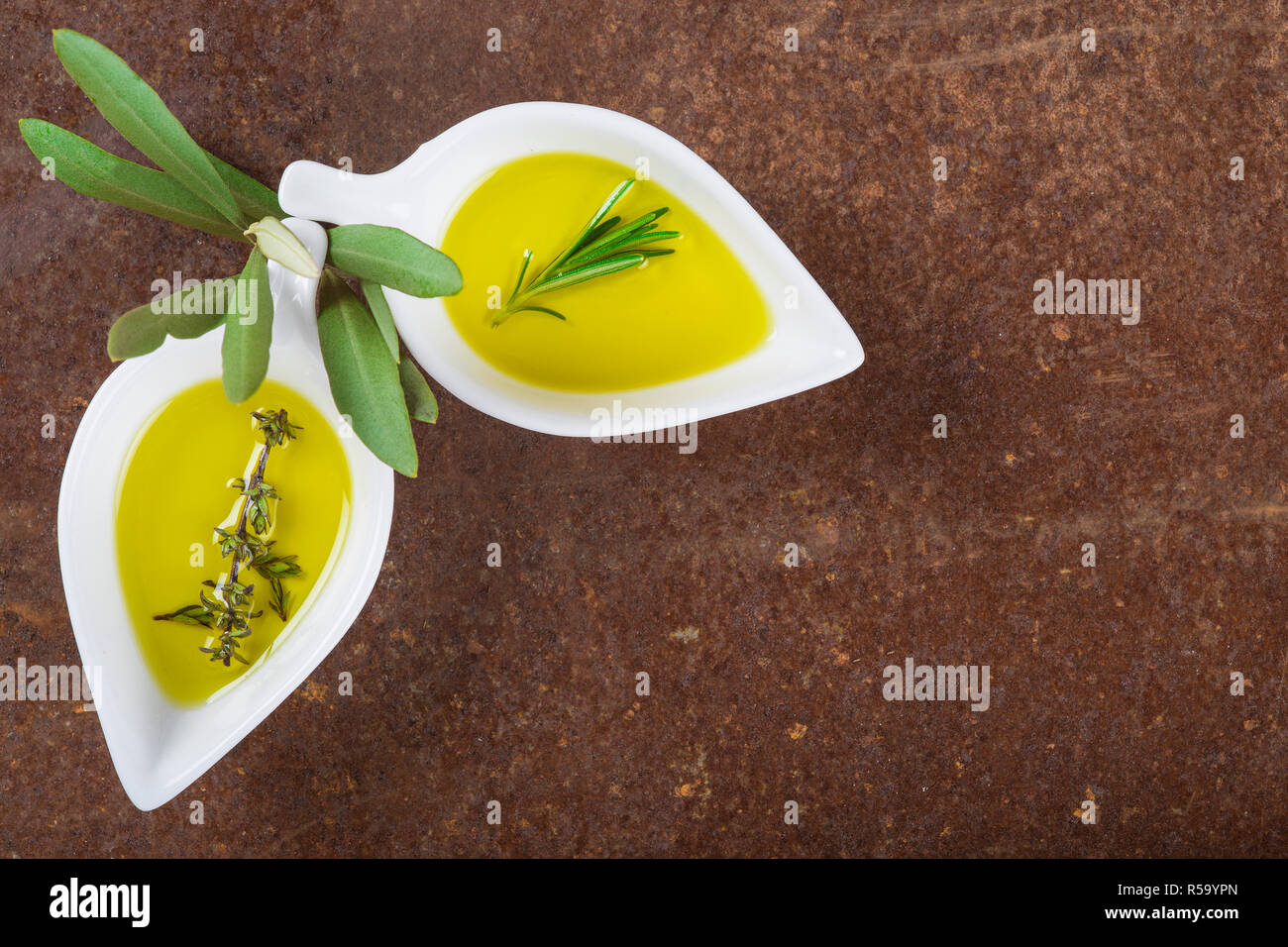 Extra virgin olive oil and green olives Stock Photo - Alamy
