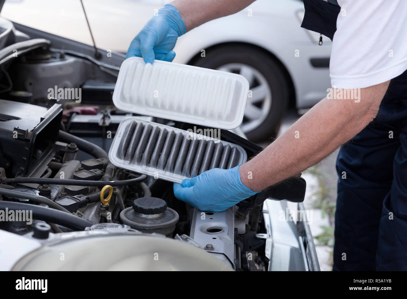 Car engine air filters, old and new Stock Photo Alamy