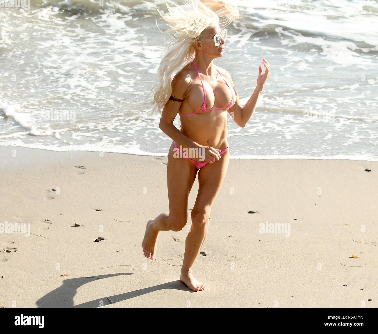 Celebrity Big Brother' star Frenchy Morgan wearing a tiny bikini while  jogging on the beach in