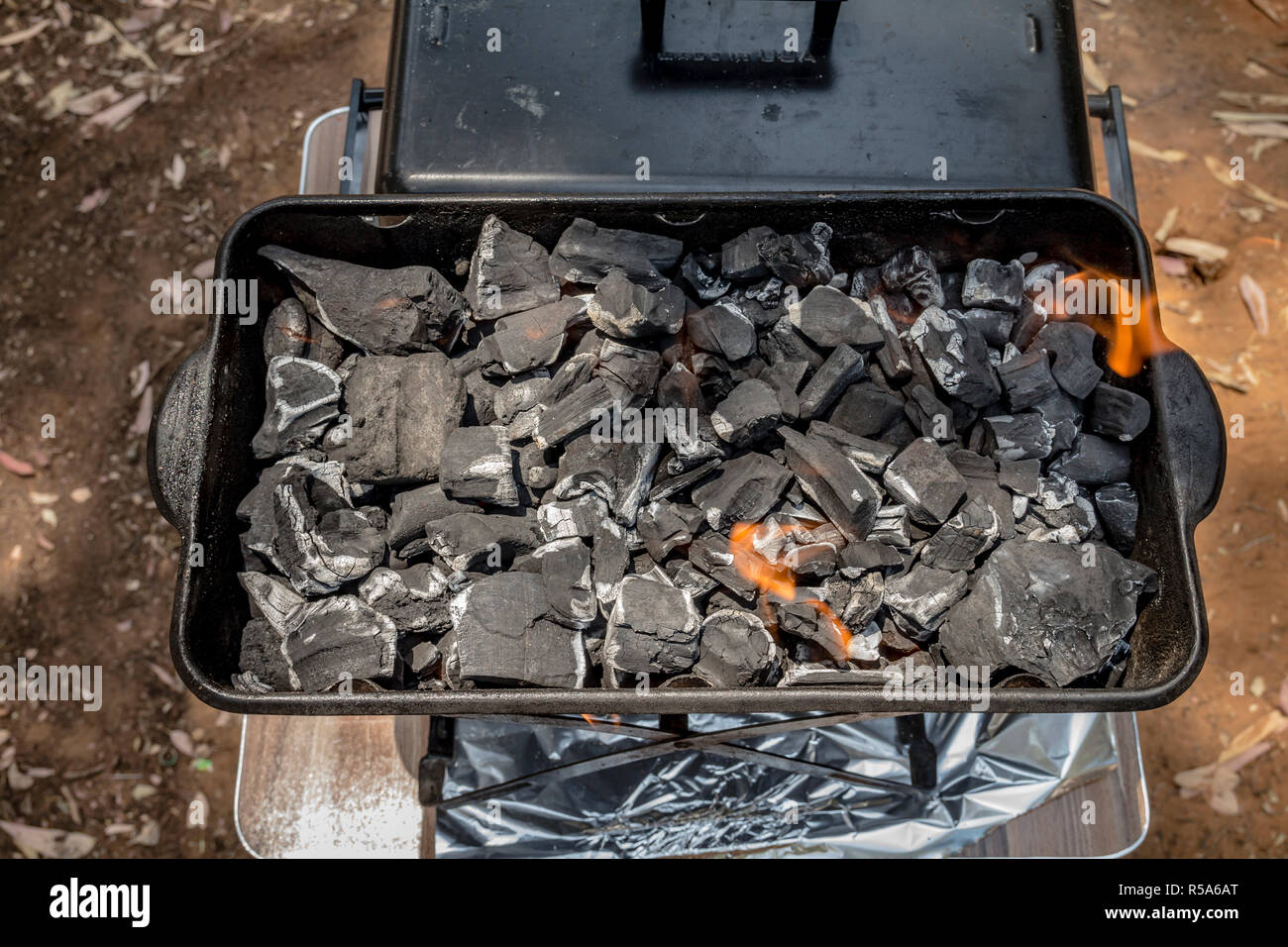 Coals are burned in a BBQ grill Stock Photo Alamy