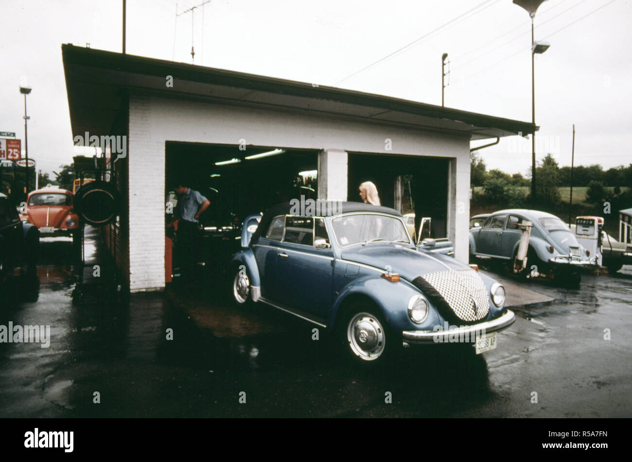 September 1975 Young Woman Has Stopped at a Service Station for