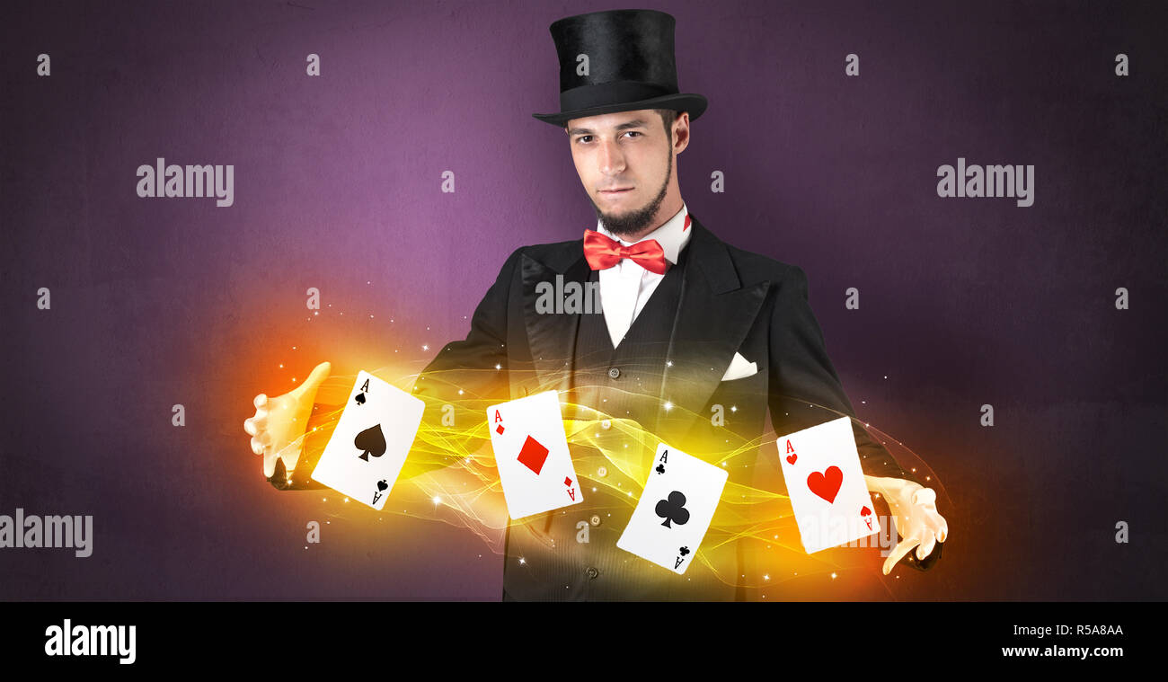 Illusionist in tails bandy play cards between his two hands Stock Photo ...