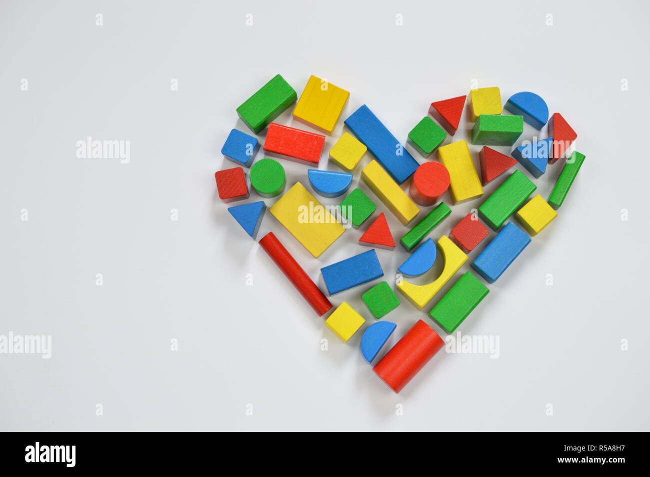 a heart composed of colorful wooden blocks Stock Photo - Alamy