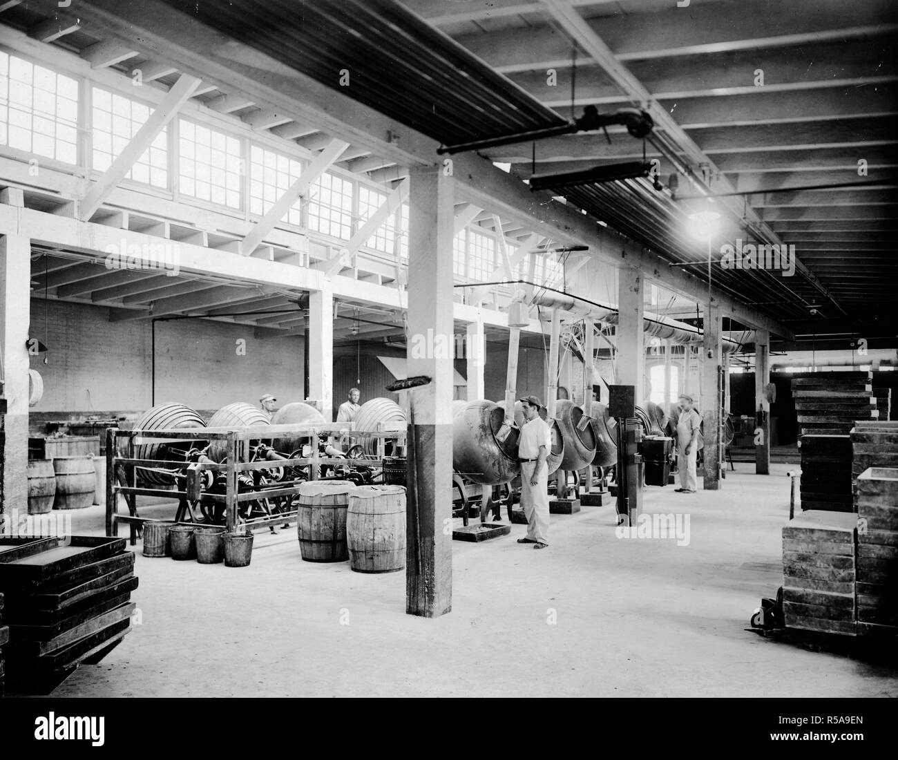 Industries of War - Chewing Gum - MAKING CHEWING GUM AND CHOCOLATE FOR SOLDIERS. General view of Pan Room of Frank H. Fleer Co., Philadelphia, Pennsylvania ca. 1918 Stock Photo