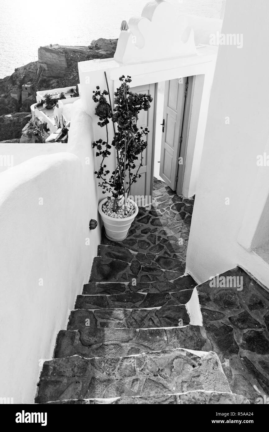 A cobbled street in Oia village, Santorini island in Greece. Stock Photo