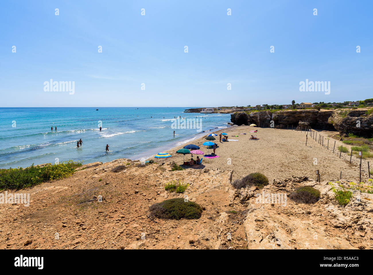 Crystal clear sea water at Cittadella dei Maccari, San Lorenzo, Vendicari Nature Reserve, Sicily. Dreamy and idyllic holiday destination near Noto. Stock Photo