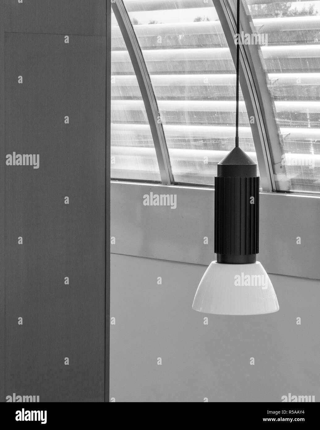 Artistic Black And White Photo Of A Ceiling Light And Wall