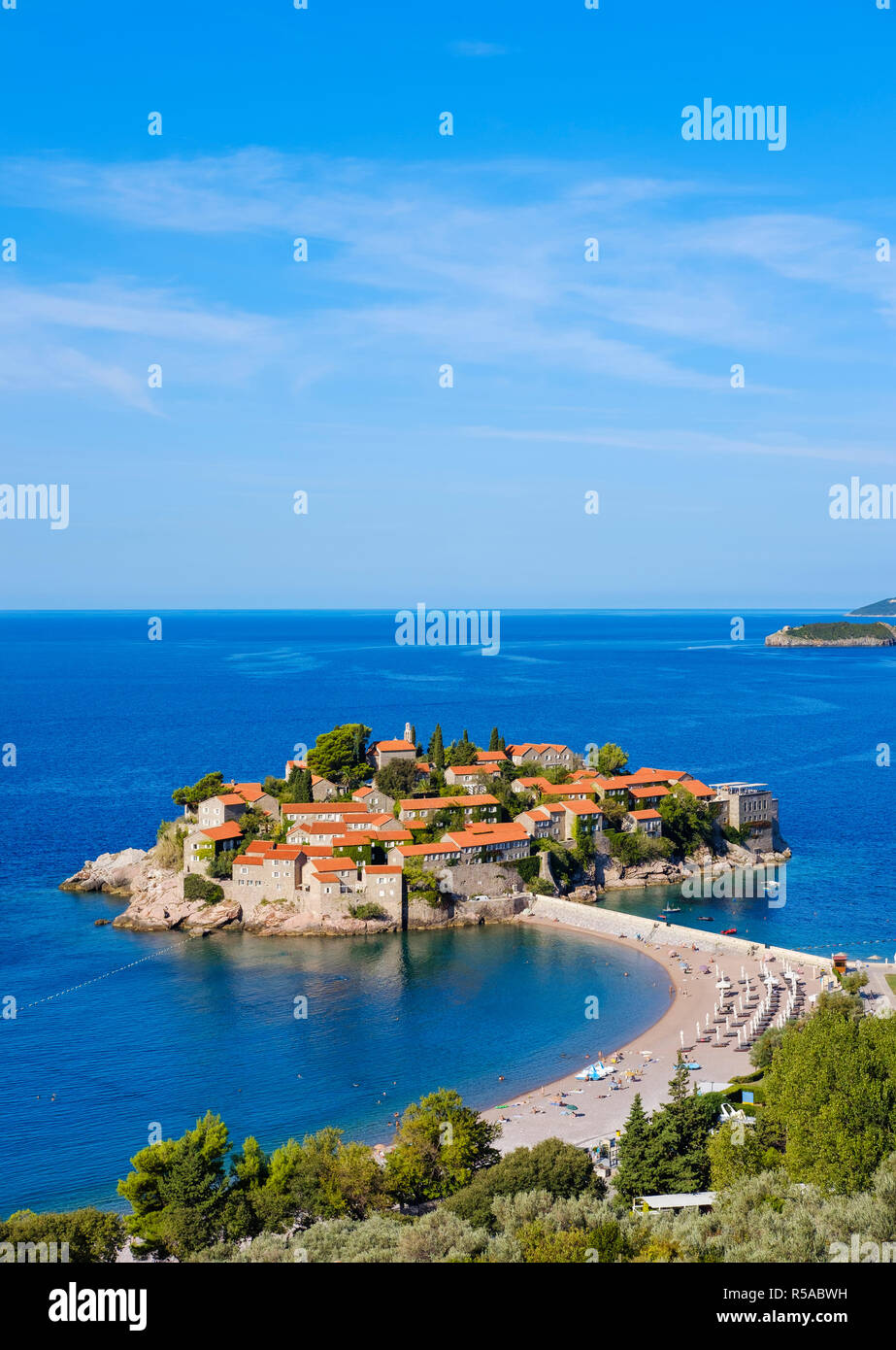Island Sveti Stefan with dam, near Budva, Adriatic coast, Montenegro Stock Photo