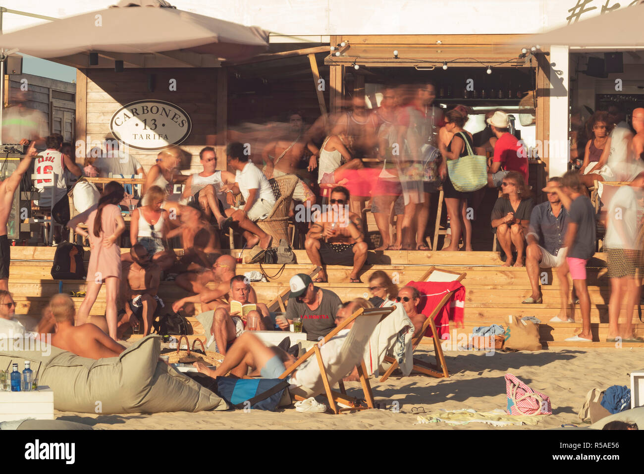 Multitude of people at a beach bar. Tarifa, Costa de la Luz, Cadiz, Andalusia, Spain. Stock Photo