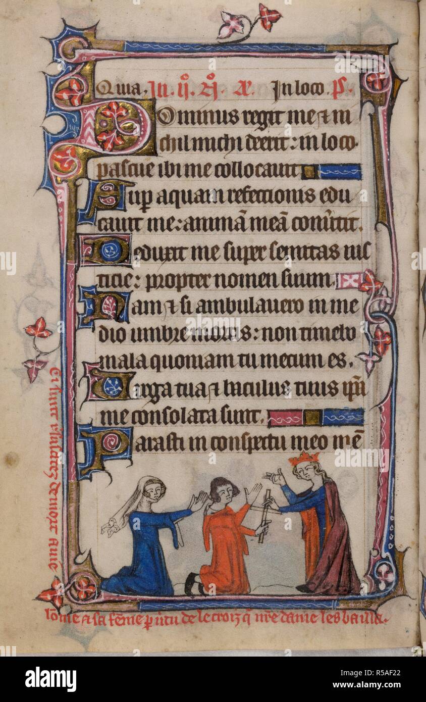 Bas-de-page scene of the Virgin Mary reviving the man and his wife and giving the man a cross, with a caption reading, â€˜Ci sunt r[e]suscitez de mort a vie lo[m]me et sa fe[m]me p[ar] v[er]tu de la croiz q[ue] n[ost]re dame les baillaâ€™ . Book of Hours, Use of Sarum ('The Taymouth Hours'). England, S. E.? (London?); 2nd quarter of the 14th century. Source: Yates Thompson 13, f.165v. Language: Latin and French. Stock Photo