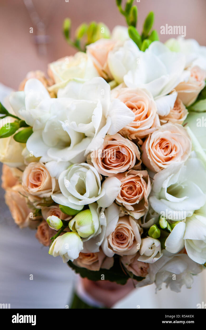 Beautiful wedding bouquet in hands of the bride Stock Photo - Alamy
