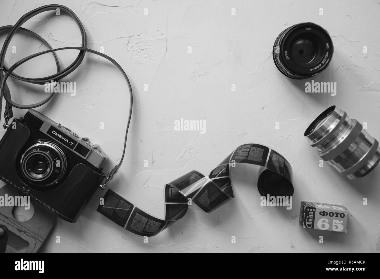 vintage camera, film, retro lenses on white table Stock Photo