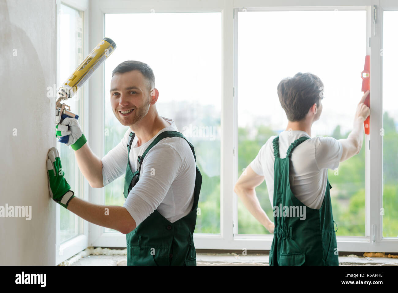 Workers are installing a window Stock Photo