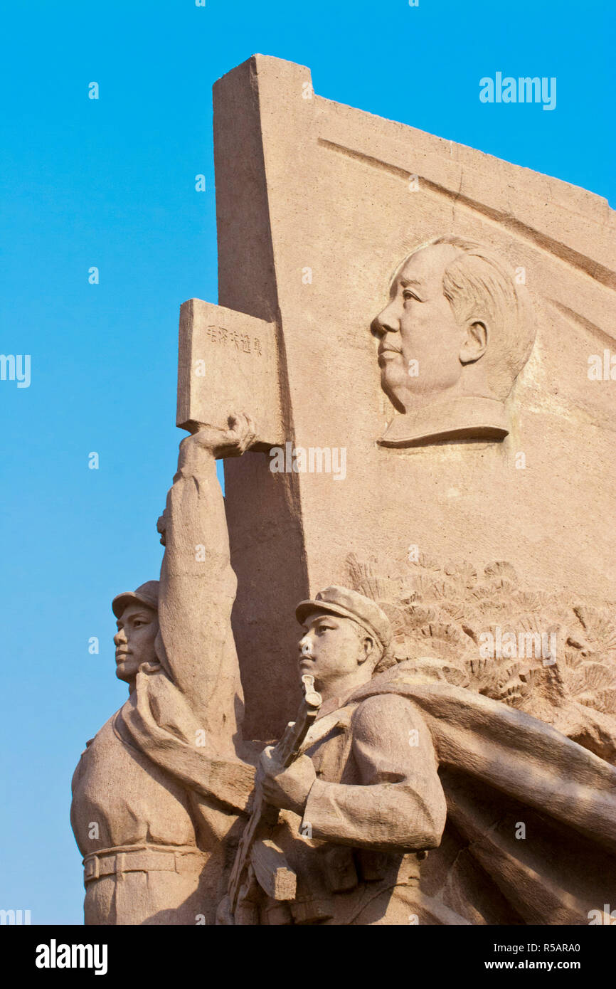 China, Beijing, Tiananmen Square, Chairman Mao and the  thoughts of Chairman Mao red book on sculpture  near the Mausoleum of Mao Zedong Stock Photo