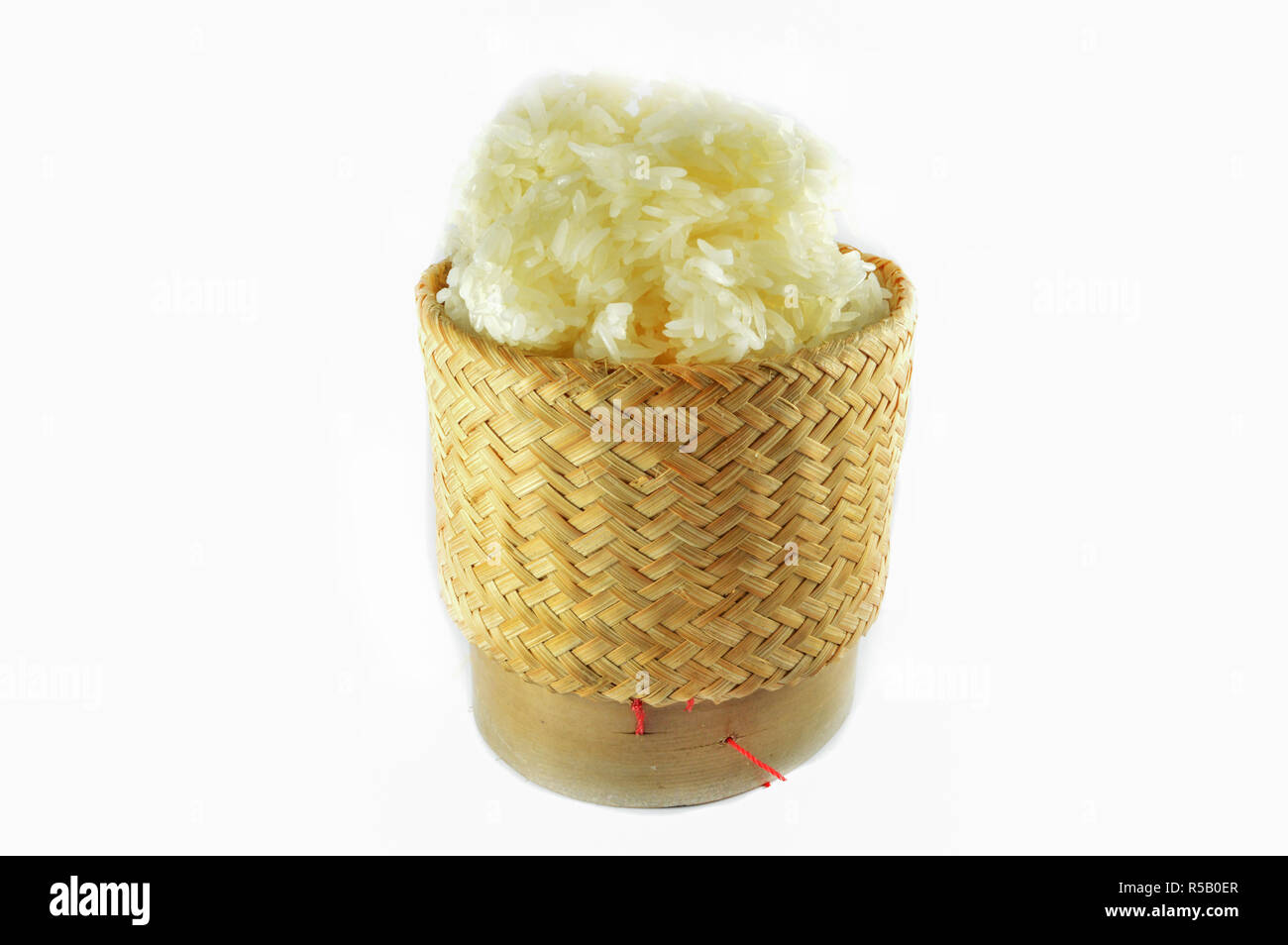 https://c8.alamy.com/comp/R5B0ER/thai-sticky-rice-cooked-in-rice-box-with-bamboo-wooden-rice-streamed-isolated-on-white-background-R5B0ER.jpg